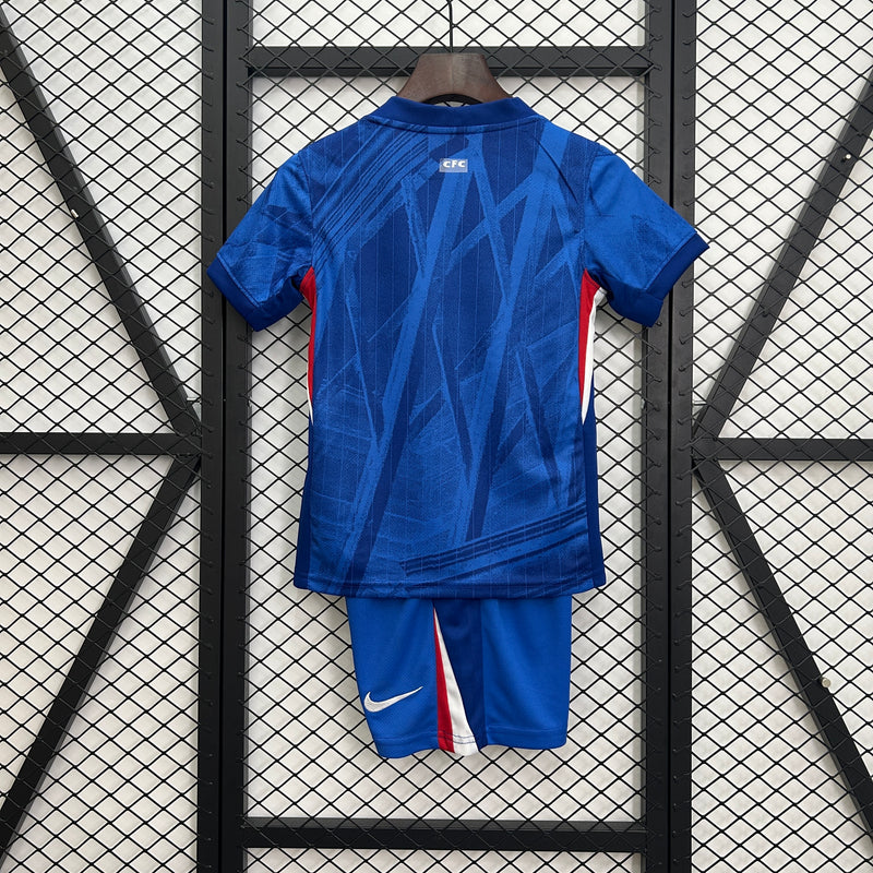 CAMISOLA CHELSEA I 25/26 – CONJUNTO INFANTIL DO EQUIPAMENTO PRINCIPAL AZUL