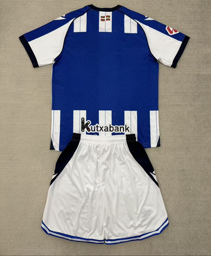 Camisola Real Sociedad I 2526 – Conjunto Infantil